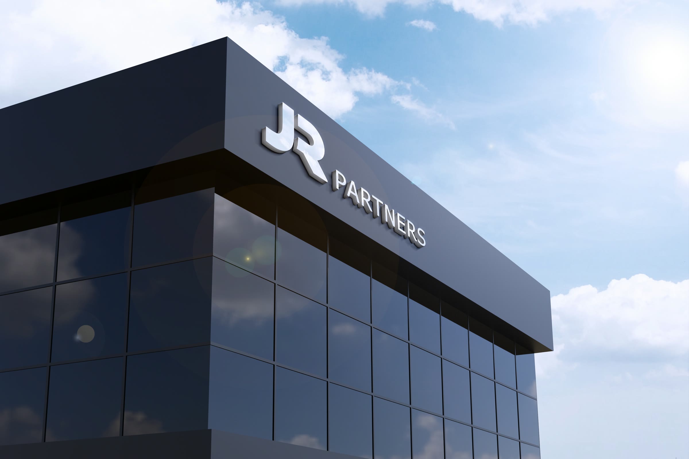 JR Partners: the logo on top of a dark glass office building